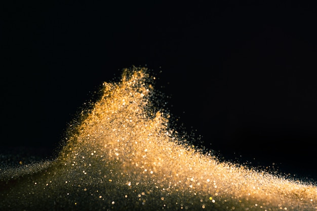 Funkeln beleuchtet Schmutzhintergrund, defocused abstraktes Twinkly Gold des Goldfunkelns beleuchtet Hintergrund.