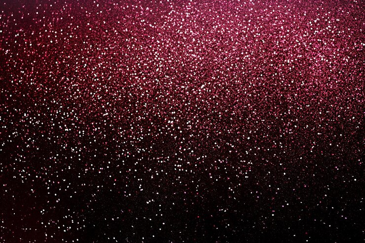 Funkelnde rosa Glitzer-Textur auf dunklem Hintergrund