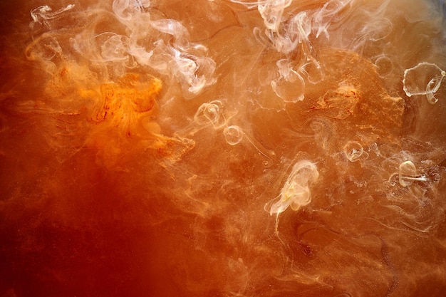 Fusión naranja melocotón remolino de humo fondo abstracto Mezcla de pinturas líquidas brillante jugoso pigmento niebla telón de fondo
