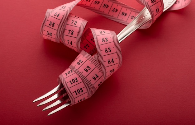 Gabel in einen Zentimeter gewickelt. Gewichtsverlust Symbol