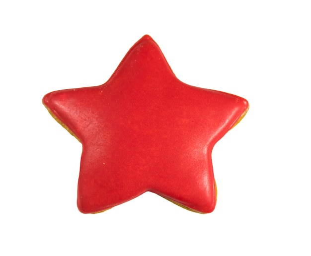 Galleta de jengibre en forma de estrella aislado sobre fondo blanco.