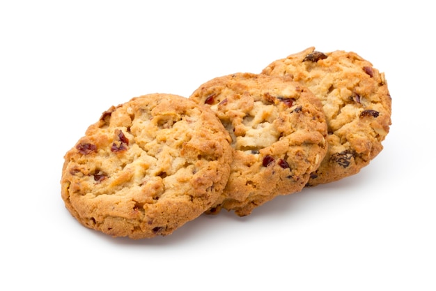 Galletas de avena con arándanos sobre una superficie blanca.