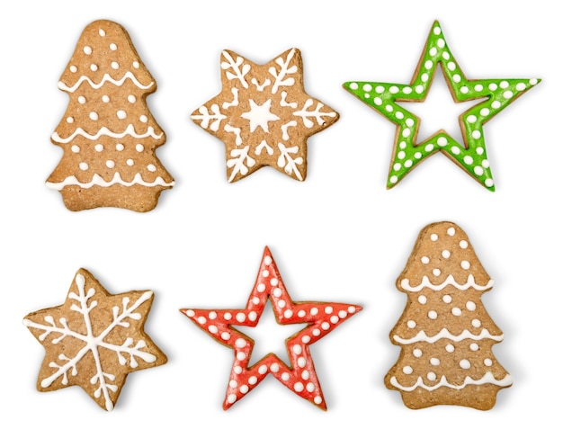 Galletas de jengibre y miel de Navidad sobre fondo blanco aislado. Estrella, abeto, forma de copo de nieve