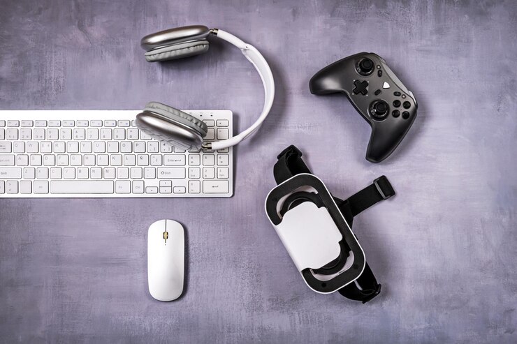Foto un gamepad gafas 3d teclado de pc y accesorios en una superficie púrpura