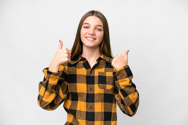 Foto garota adolescente sobre fundo branco isolado, dando um polegar para cima gesto