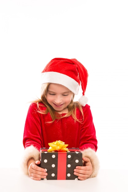 Foto garota de garoto de natal papai noel feliz animado com presente de fita