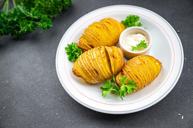 gebackene Kartoffel scharfes Stück Akkordeon Portion Gemüse Mahlzeit Nahrung Snack auf dem Tisch Kopie Raum Nahrung