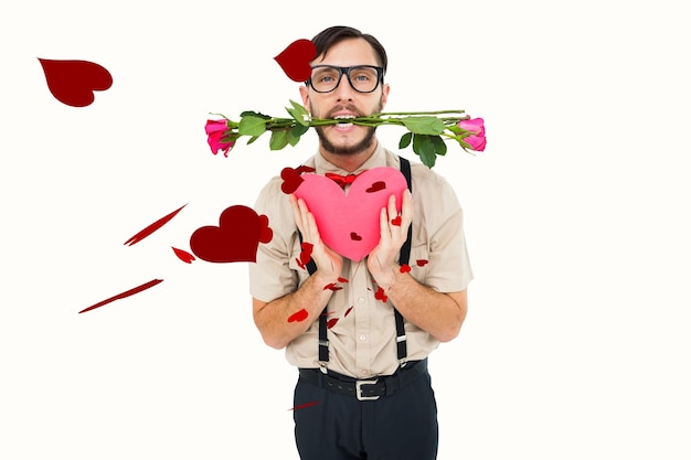 Geeky hipster oferecendo presentes de dia dos namorados contra corações vermelhos de amor