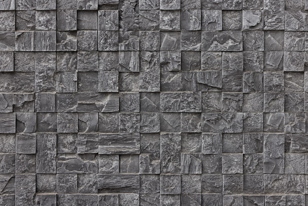 Foto gefälschte steinmauer-plastikplatte, die ein kleines kubiedes mauermosaikmosaik nachahmt
