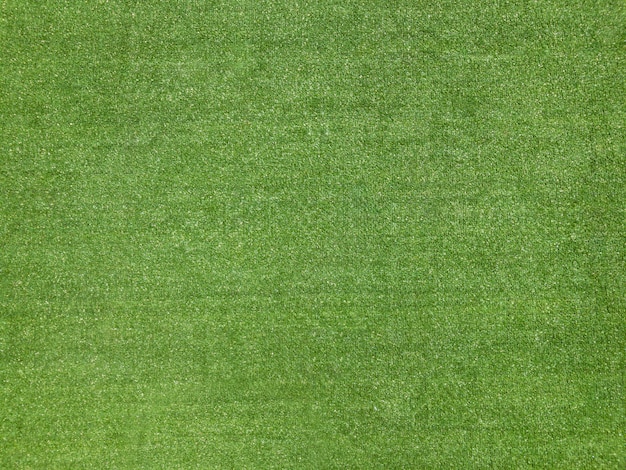 Foto gefälschter grasbeschaffenheitshintergrund des grünen fußballplatzes