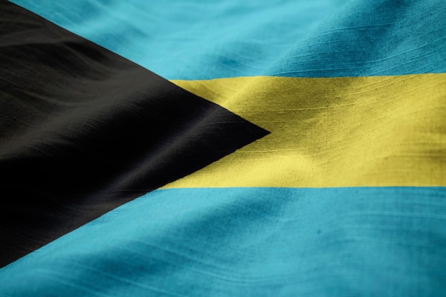 Foto gekräuselte flagge von bahamas, die im wind durchbrennen