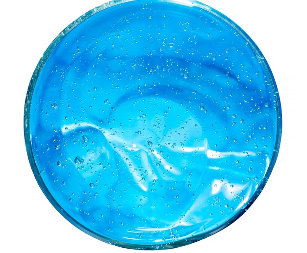 Gel con ácido hialurónico Fondo azul con burbujas de oxígeno Gel cosmético en una placa de petri