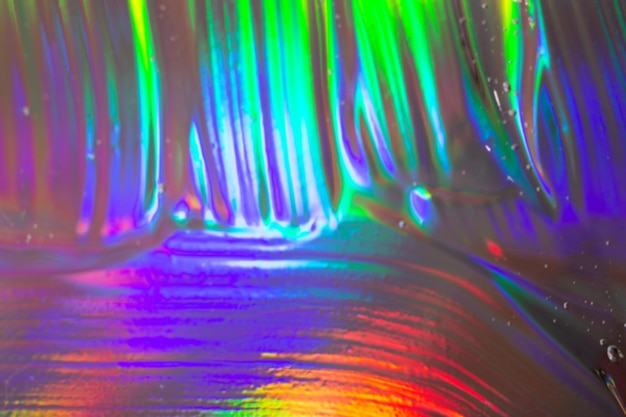 Gel cosmético borroso abstracto sobre fondo holográficoBueno como banner cosmético Enfoque selectivo