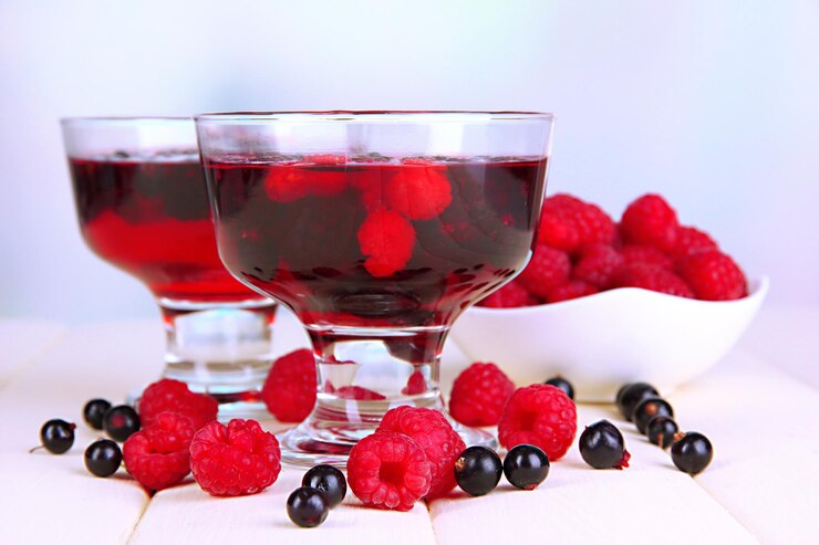 Foto gelatina com frutas frescas na mesa de madeira