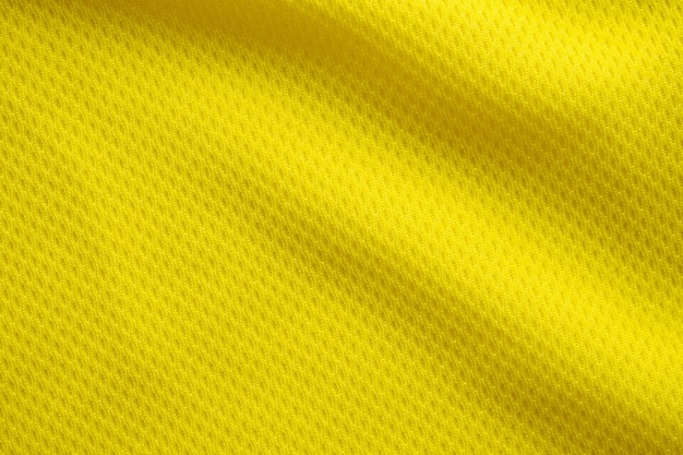 Gelbe Farbe Fußballtrikot Kleidung Stoff Textur Sport tragen Hintergrund, Nahaufnahme