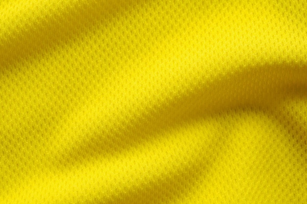 Gelbe Farbe Fußballtrikot Kleidung Stoff Textur Sportbekleidung Hintergrund hautnah