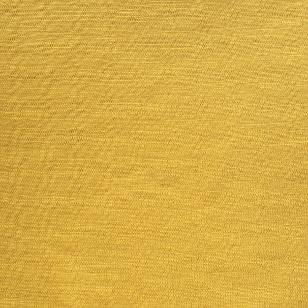 Foto gelber baumwollgewebebeschaffenheitshintergrund