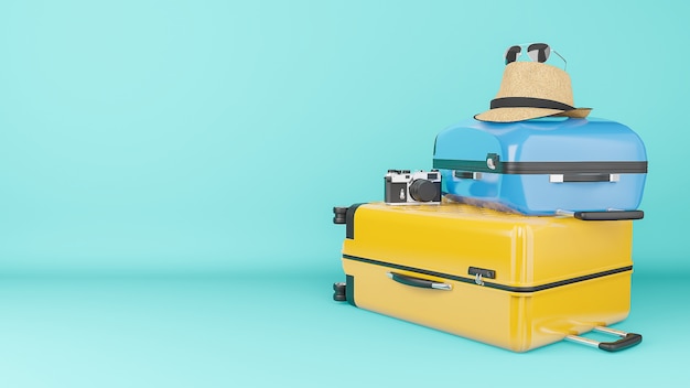 Gelber und blauer Koffer mit Sonnenhut und Brille