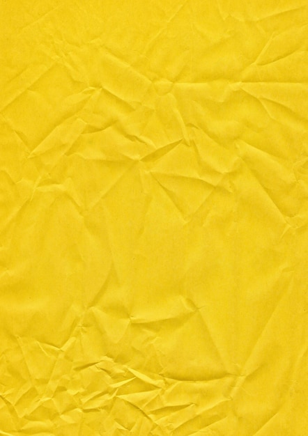 Gelbes Blatt Papier mit kleinen Falten auf der Oberfläche