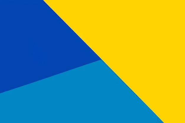 Geometrischer gelber und blauer Papierhintergrund