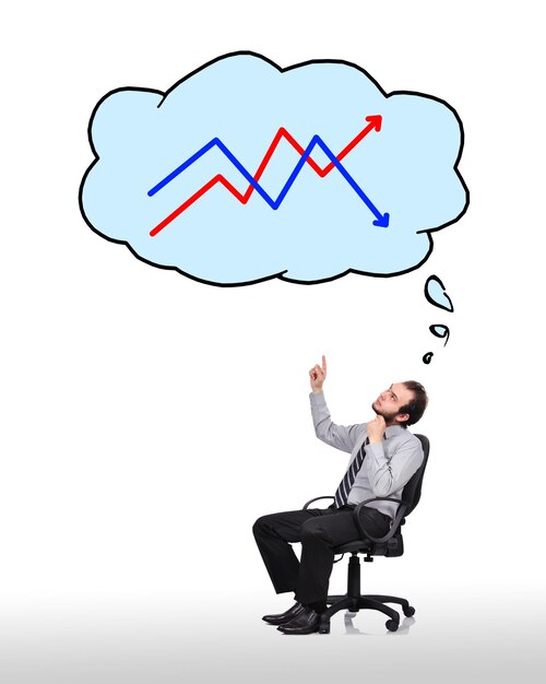 Geschäftsmann, der auf Diagramm zeigt