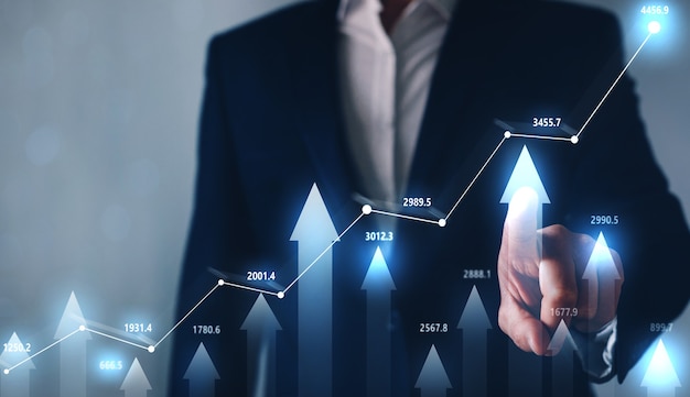 Geschäftsmann, der Forex-Diagramm erhöht.