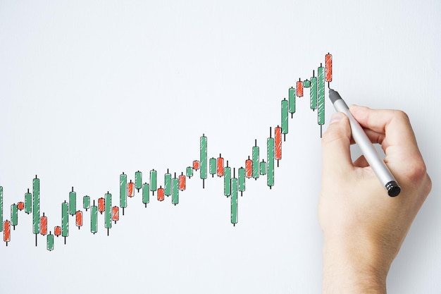 Geschäftsmannhand mit Federzeichnung kreatives Farbkerzendiagramm