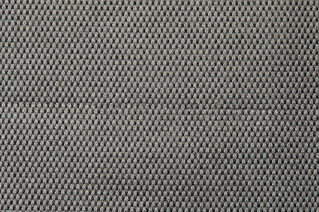 Gestrickte Textur Textur aus Jacquard-Stoff mit grauem geometrischem Muster Gehäkeltes Mosaikmuster