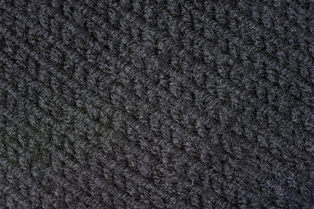 Gestrickter Texturhintergrund. Handgestrickte Wolle. Makrofotografie einer Fadenzeichnung