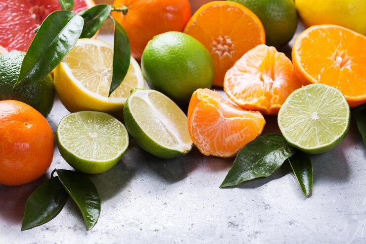 Foto gesunde ernährung ernährung natur konzept zitrusfrüchte vitamin hintergrund orange grapefruit mandarine limette zitrone mit blättern auf einem tisch kopieren sie raum hintergrund