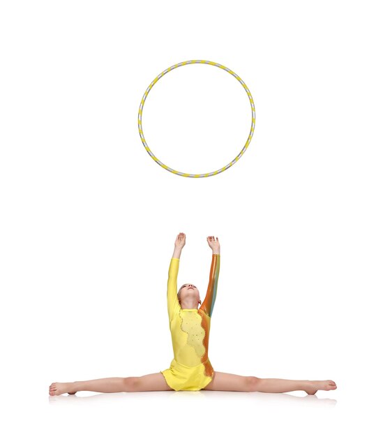 Foto girlgymnastthrows up hula hoop