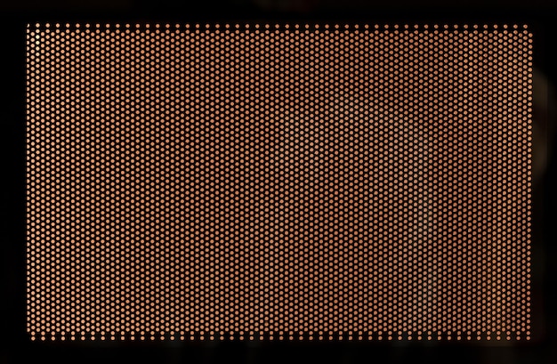 Gitter auf einer Mikrowellenherdtür Beschaffenheits-Nahaufnahme