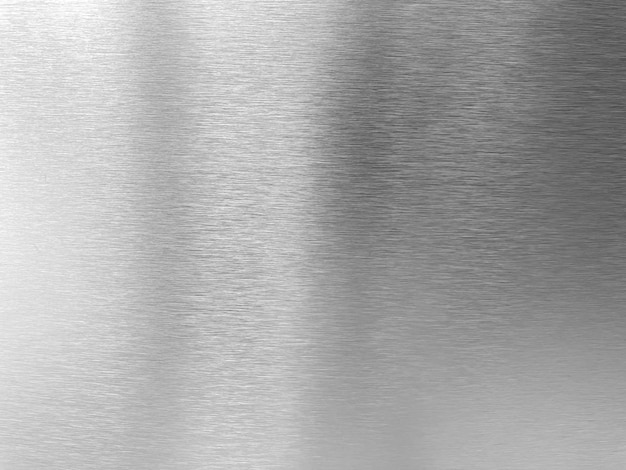 Foto glänzender, silberfarbener, gebürsteter edelstahlplattenhintergrund. abstrakter metalltexturhintergrund oder aluminiumbanner. plattenmaterial aus chrom-platin-oberfläche