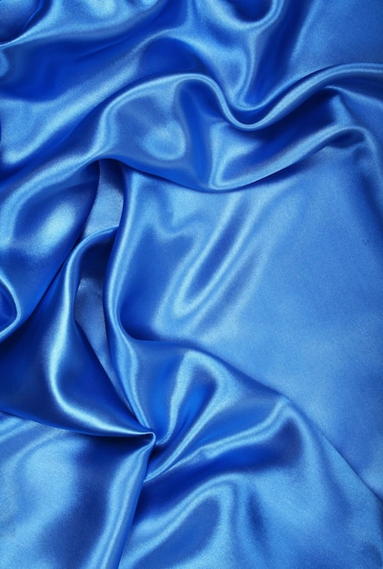 Glatte elegante blaue Seide kann als Hintergrund verwendet werden