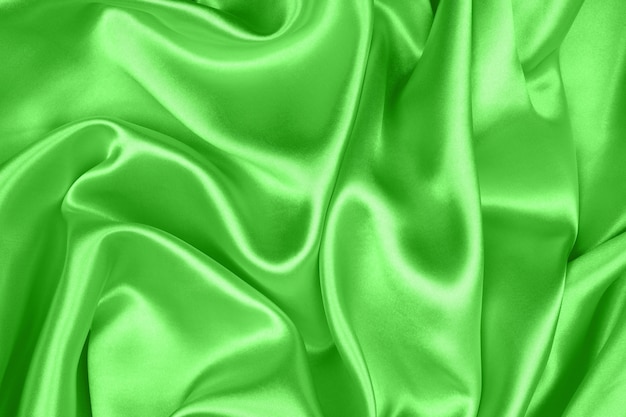 Glatte, elegante grüne Seide oder Satinstruktur kann als Hintergrund, Stoff verwendet werden
