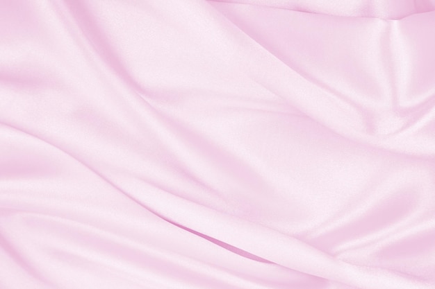 Glatte elegante rosa Seide oder Satin-Textur als Hochzeits-Hintergrund
