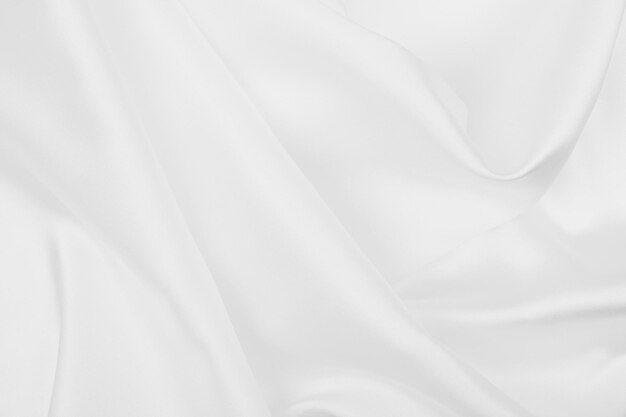 Glatte, elegante weiße Seide oder Satin-Luxus-Tuch-Textur als Hochzeitshintergrund