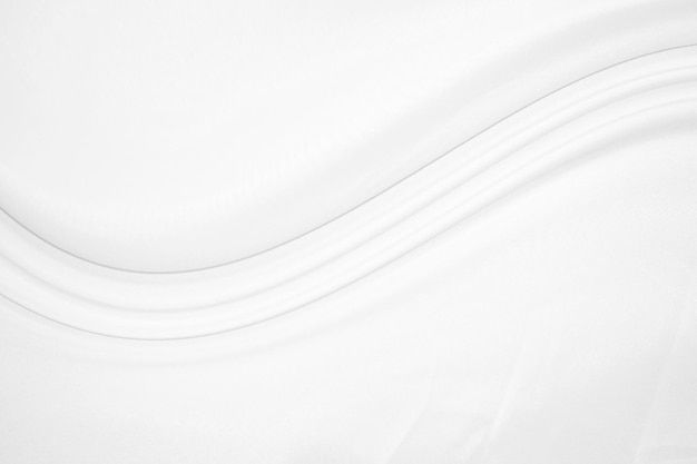 Glatte elegante weiße Seide oder Satin-Luxus-Tuch-Textur kann als Hochzeitshintergrund verwendet werden Luxuriöses Hintergrunddesign