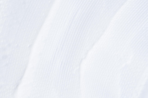 Glatte weiße Rasierschaumstruktur für weiße Flecken Körnung aus weißem Schaum in der Nähe Schäumendes Kosmetikprodukt für die Hautpflege Schmierfleck