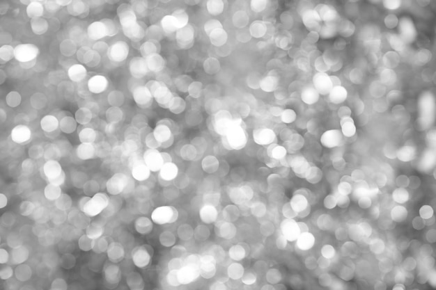 Foto glitter e bokeh de enfeites de prata. fundo desfocado festivo de natal.