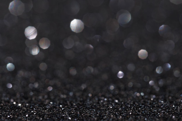 Glitter-Vintage-Lichter Hintergrund hell silber und schwarz defokussiert