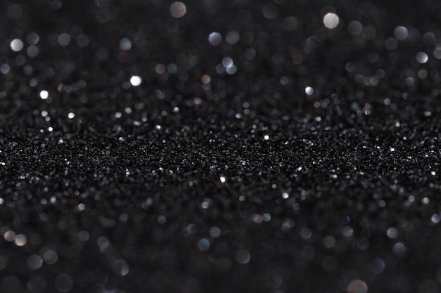 Glitter-Vintage-Lichter Hintergrund hell silber und schwarz defokussiert