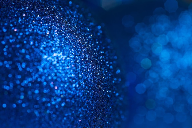 Glitzernder Hintergrund des blauen Scheins