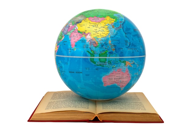 Foto globo terrestre en un libro abierto que muestra asia y australia concepto de estudio y aprendizaje