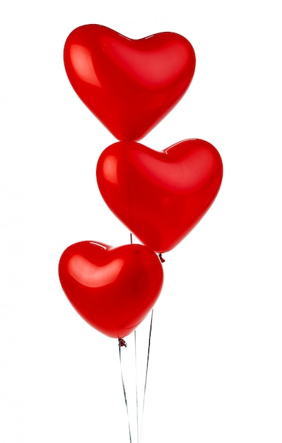 Foto globos de aire. montón de globos de papel rojo en forma de corazón