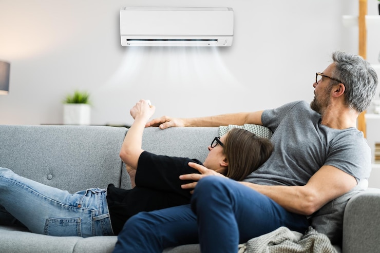 Foto glückliche familie mit klimaanlage
