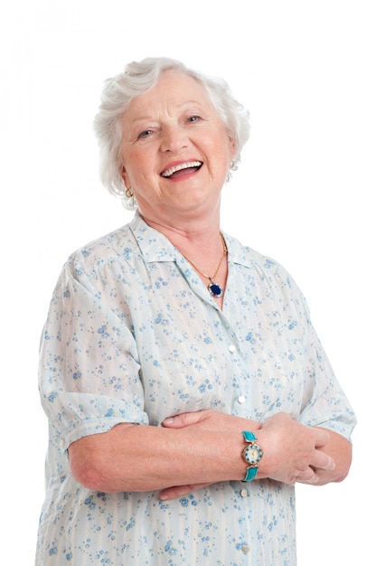 Foto glückliche freudige ältere dame und lächelnd isoliert auf weiß