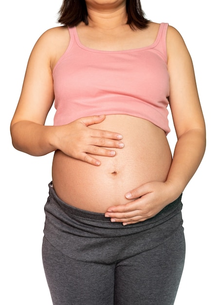 Glückliche schwangere Frau mit Baby im schwangeren Bauch lokalisiert auf weißem Hintergrund.