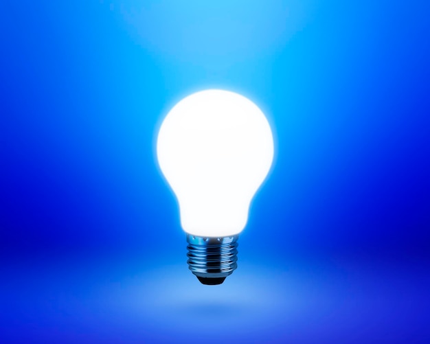 Foto glühbirne auf blauem hintergrund ideenkonzept
