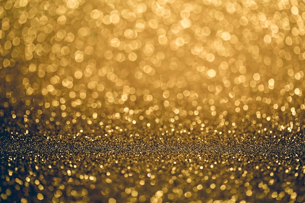 Gold Bokeh mit weißem Farbzusammenfassungshintergrund kann Gebrauch als Tapete sein